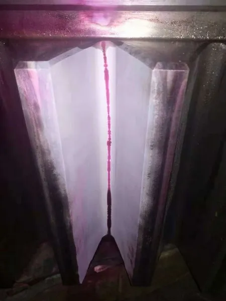 Liquid penetrant testing of quenched gear teeth